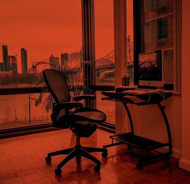 Desk overlooking Manhattan skyline.